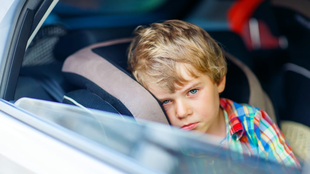 Unhappy child in car