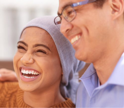 Man and woman hugging and laughing