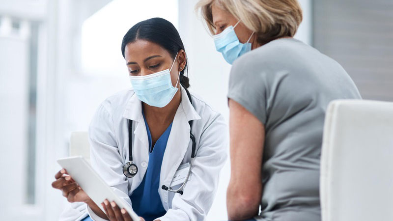 Doctor and female patient consult