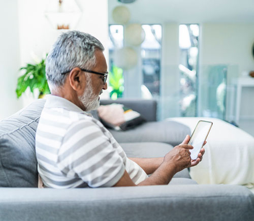 Older man looking at his phone