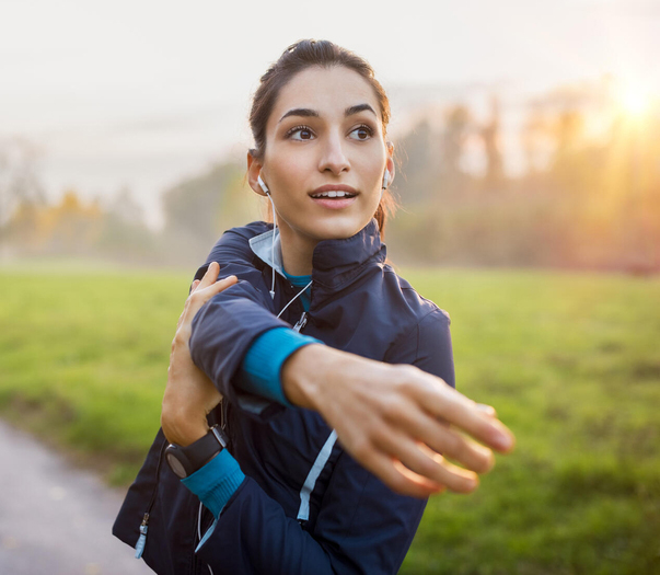 Woman stretching in park