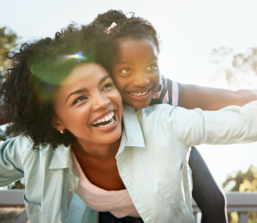 Mother and daughter playing outside