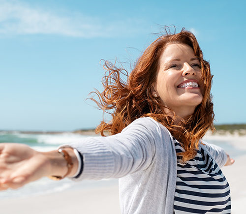 Woman smiling on the beach