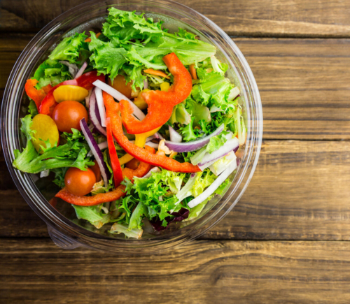 Bowl of salad on table