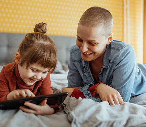 Woman and child looking at tablet