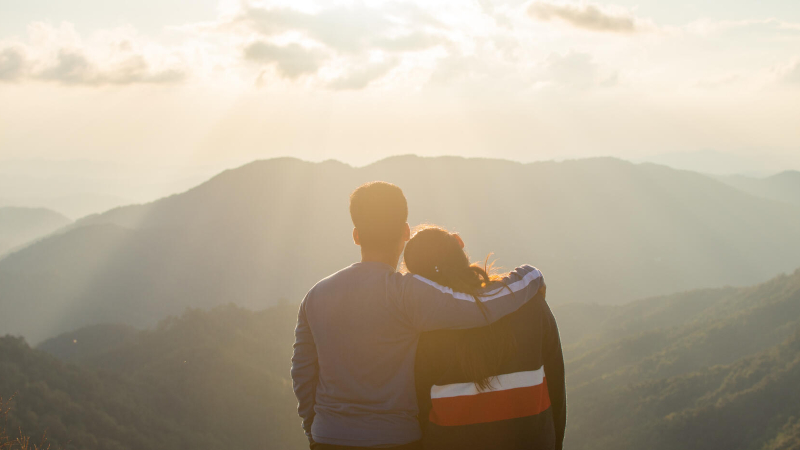 Couple looking at mountains