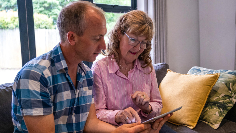 Older couple looking at their e-tablet