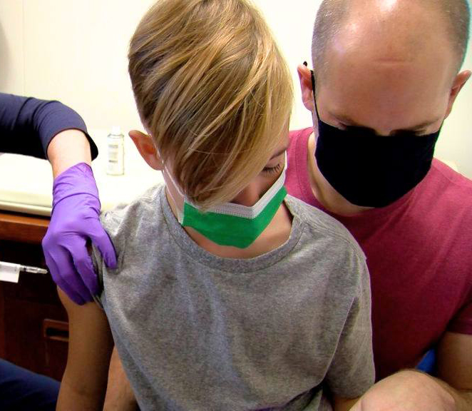 Young child receiving vaccination