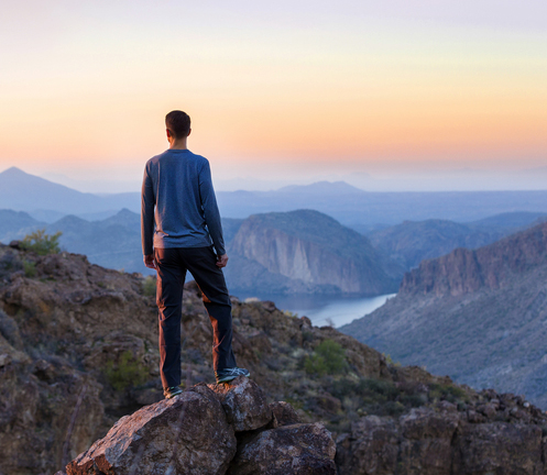 Man standing on mountaintop