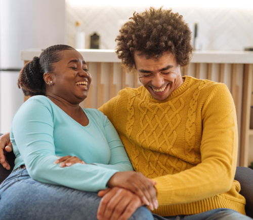 Man and woman laughing