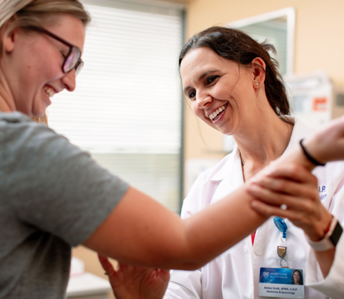 Healthcare provider examining a patient's arm