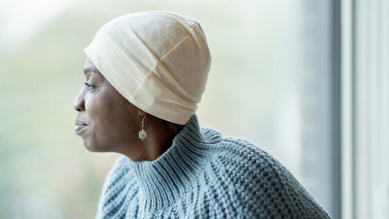 Woman looking out window