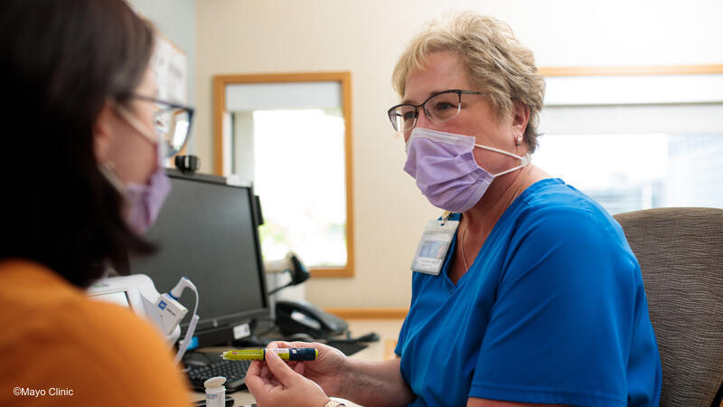 Nurse talking to patient