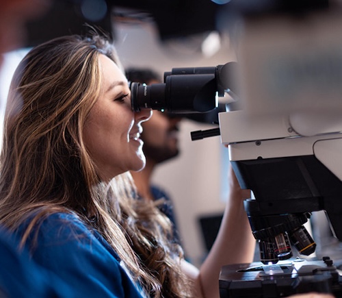 Woman using a microscope