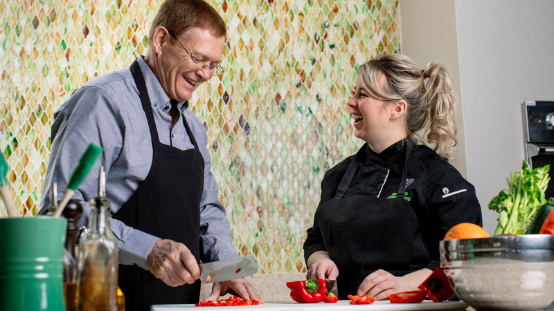 Chef Jennifer Welper chopping red bell peppers