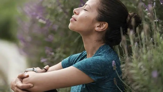 Woman relaxing with her eyes closed.