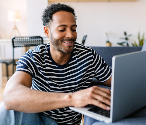 Man typing on laptop