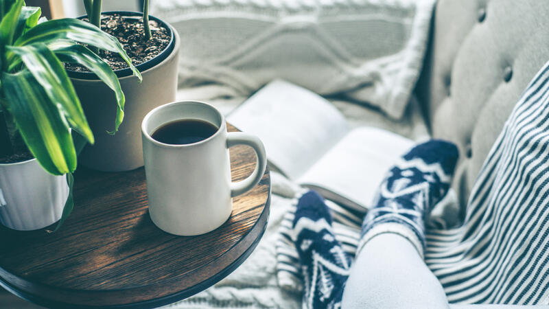Cozy scene with coffee mug and book