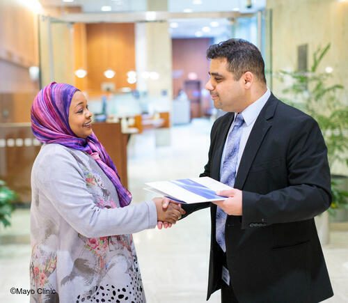 Patient shaking hands with concierge