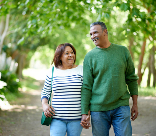 Couple holding hands on walk