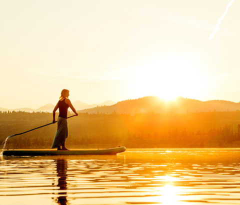 Woman on stand up paddle board