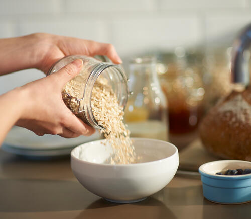 Pouring oatmeal in bowl