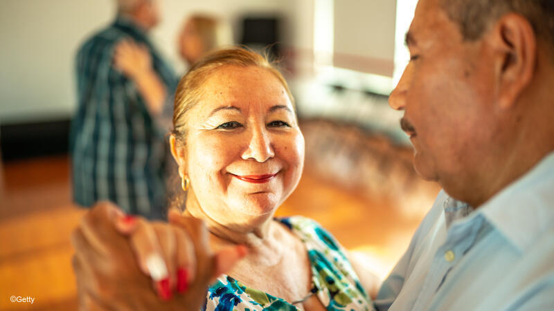 man and woman dancing together.