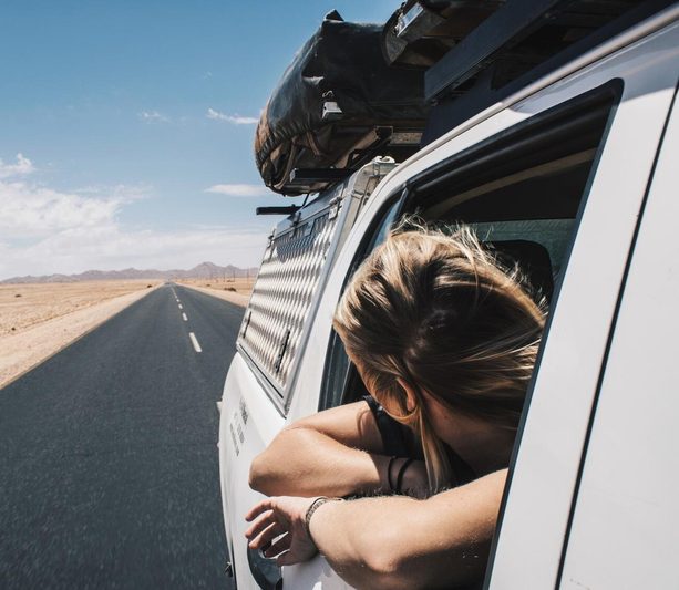 Girl looking out car window