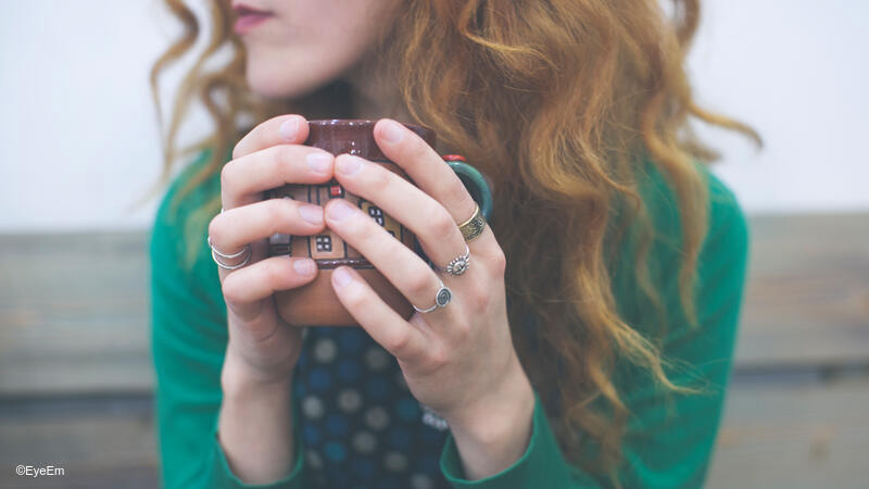 Woman holding her coffee mug