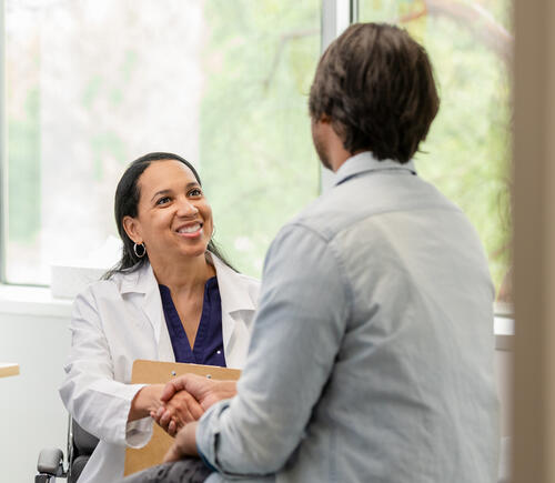 Patient shaking hands with doctor