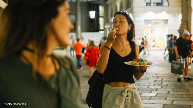 Woman eating street food