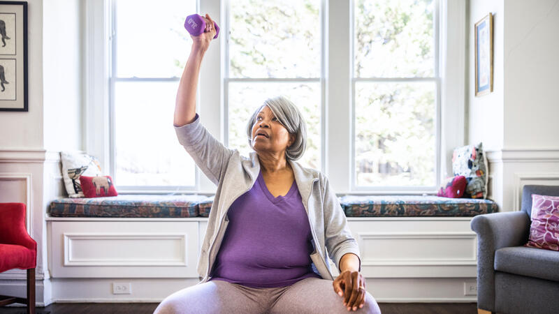 Woman using hand weights