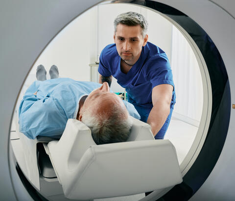 Patient being put into an imaging machine