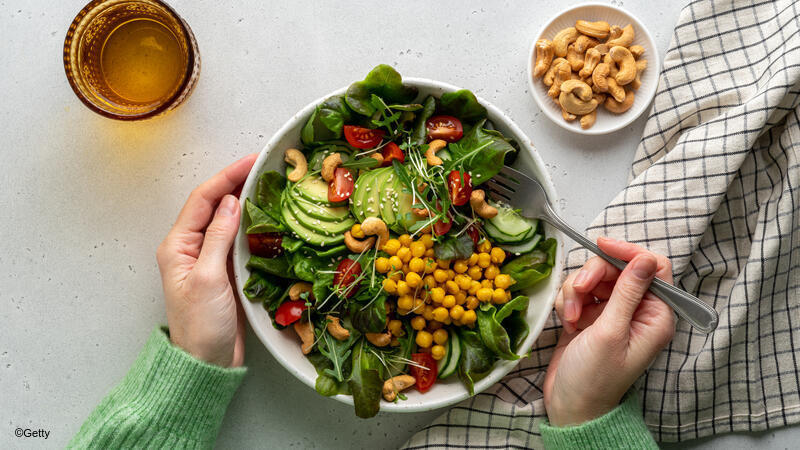 Person eating salad