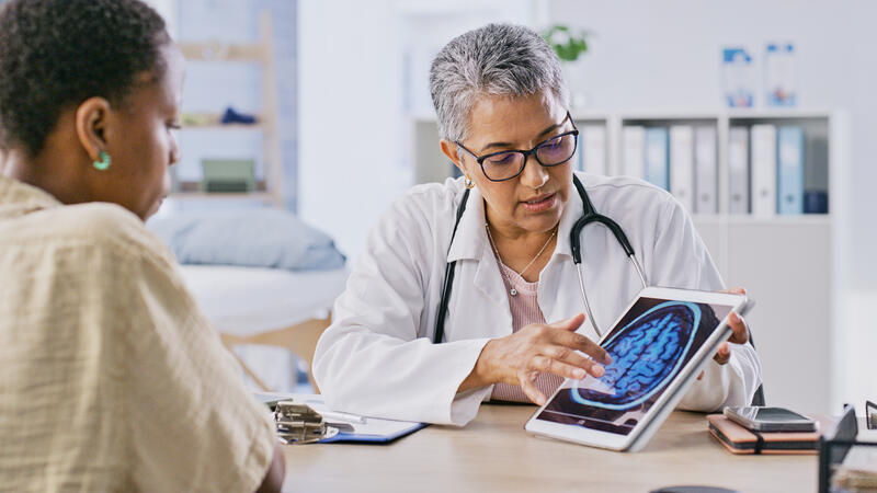 Doctor and patient reviewing brain imaging