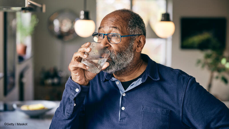 Man drinking a glass of water