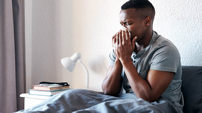 Man blowing his nose