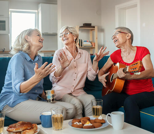 Three older adult women having fun
