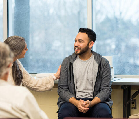 Couple talking with doctor