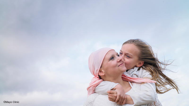 Mom and daughter embracing