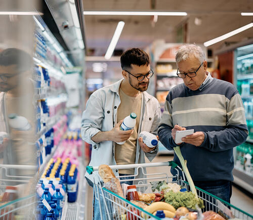 Two men grocery shopping
