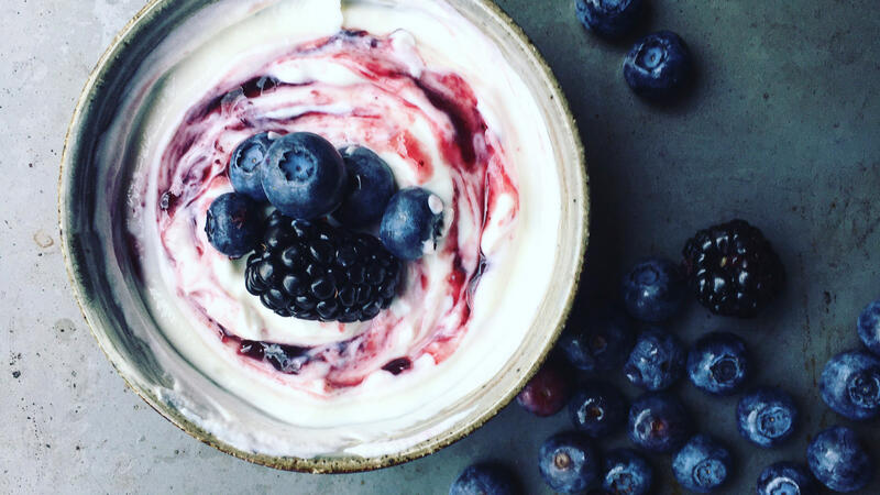 Berries and cream in a bowl