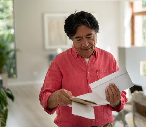 Man sorting through mail