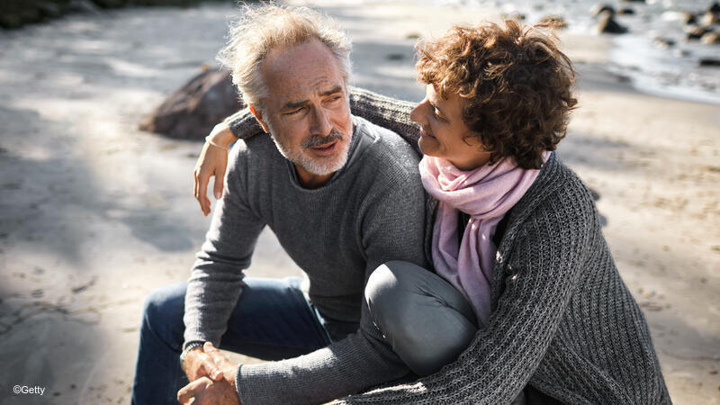 Couple talking at the beach