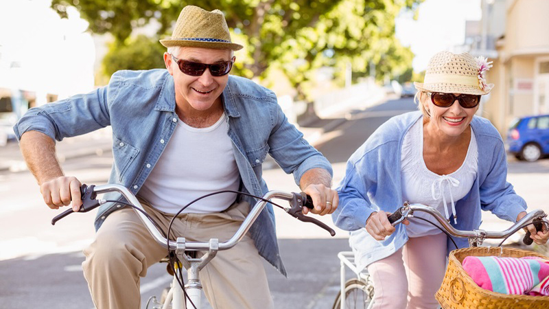 Couple having fun riding bicycles