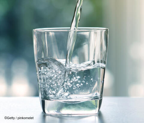 Glass being filled with water