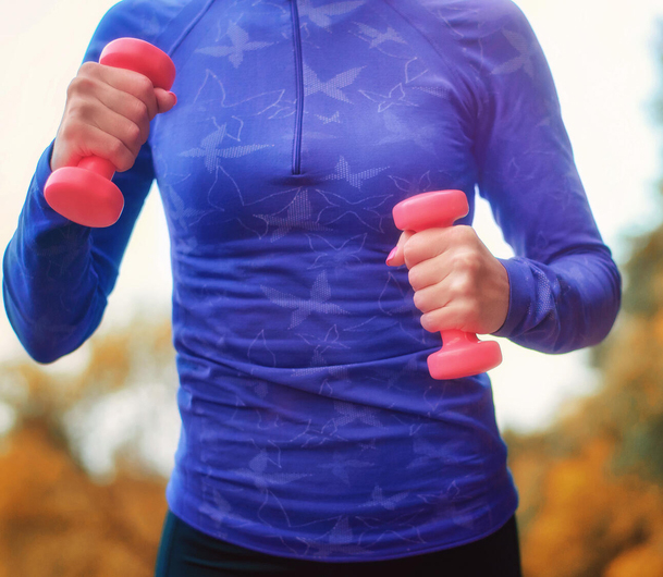 Person walking with hand weights