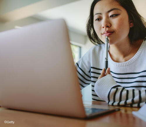 Young woman using laptop.