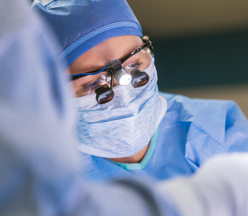 Surgeon with glasses in surgery