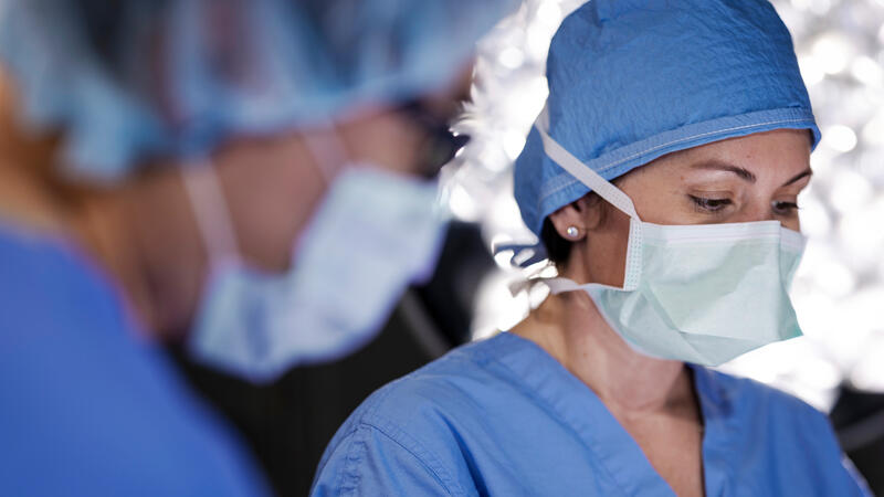 Masked doctor in surgery